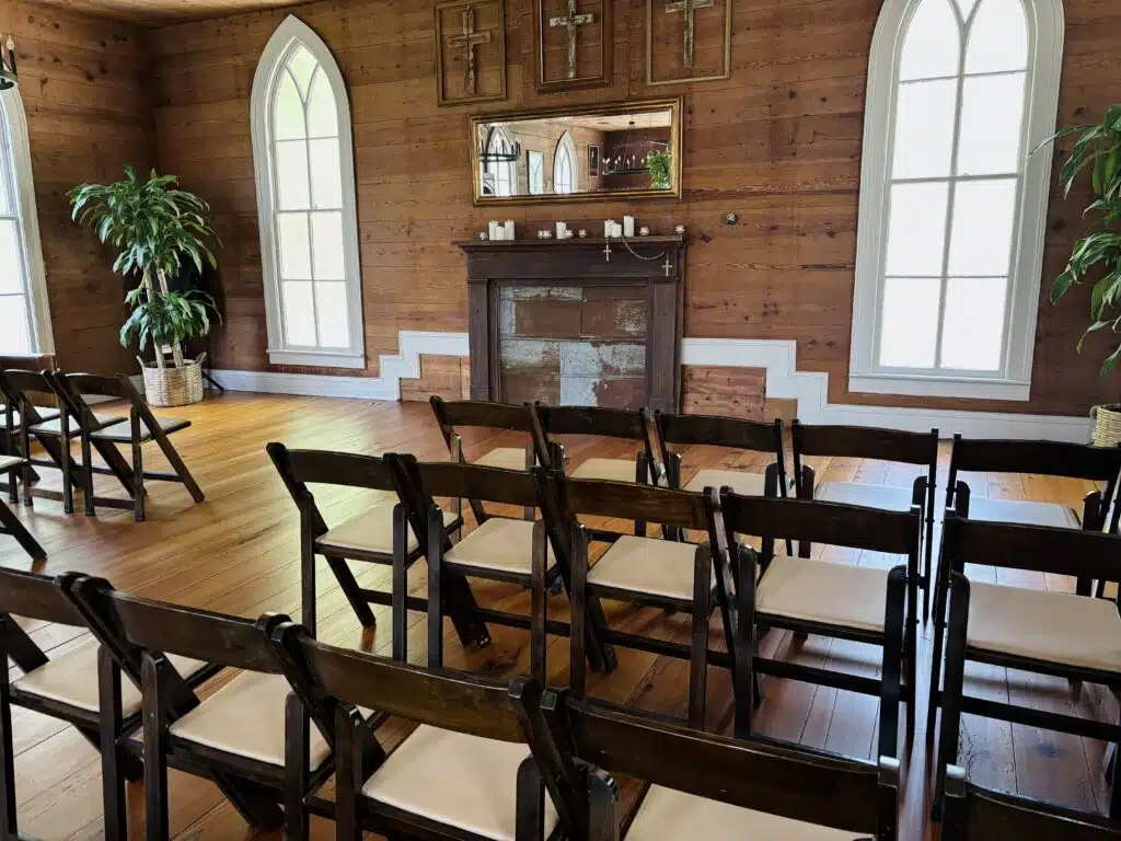 Rows of chairs set for a wedding ceremony inside the historic O'Kelly Chapel in Durham, NC